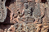 Banteay Srei temple - Shiva on Mount Kailasa (southern library east pediment) Uma sits on his lap. The ten-headed demon Ravana is shaking the mountain